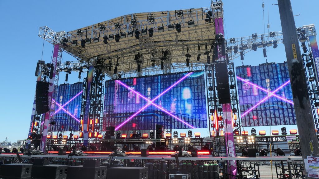 huge stage got setup in the street with daytime visible RGB Panels with holes to let the wind through