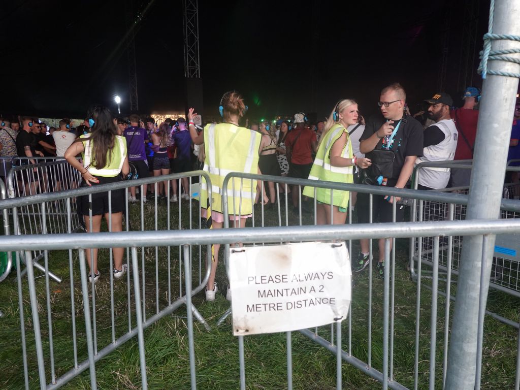 british humor, maintain 2m distance in a crowded festival