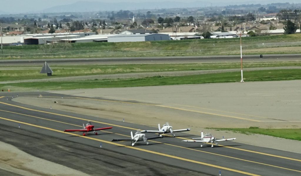group of RVs, taxing before takeoff
