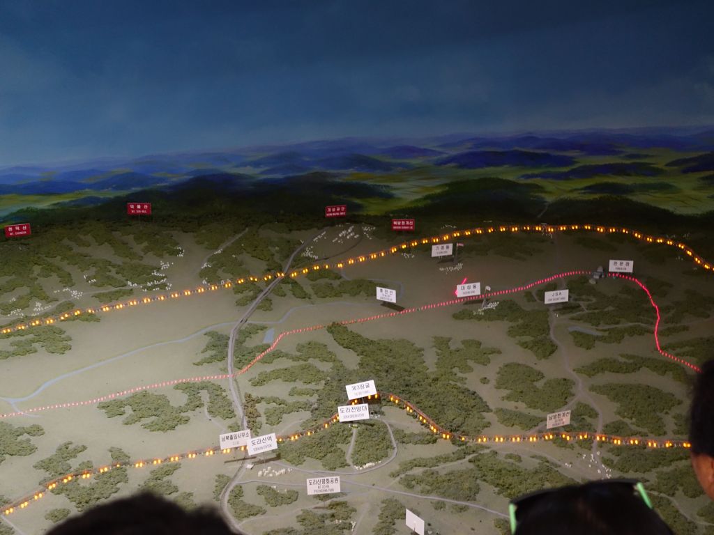 the DMZ is the no man's land area between the 2 yellow lines, with the border in red in the middle