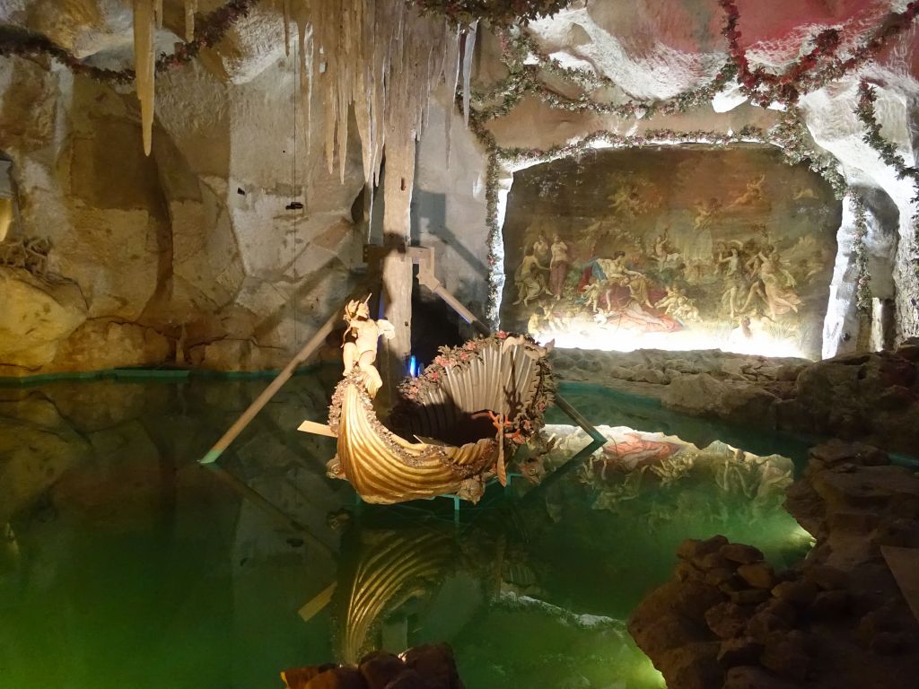 the guy built his own grotto with water, boat, and mural...