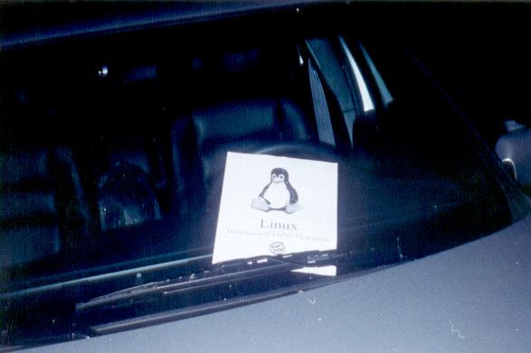 [car with linux flier on windshield]